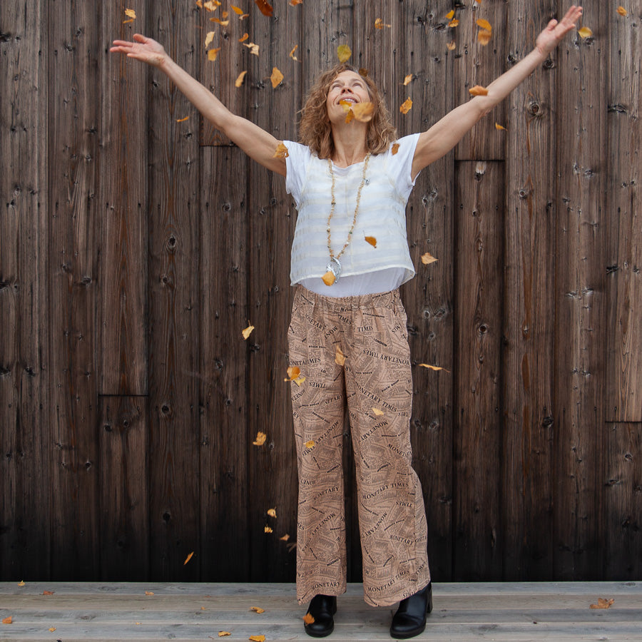 Trousers with a newspaper print
