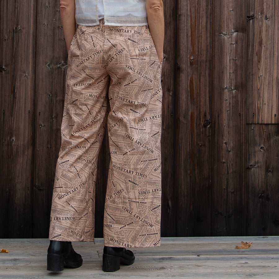 Pink trousers in newspaper fabric, M/L