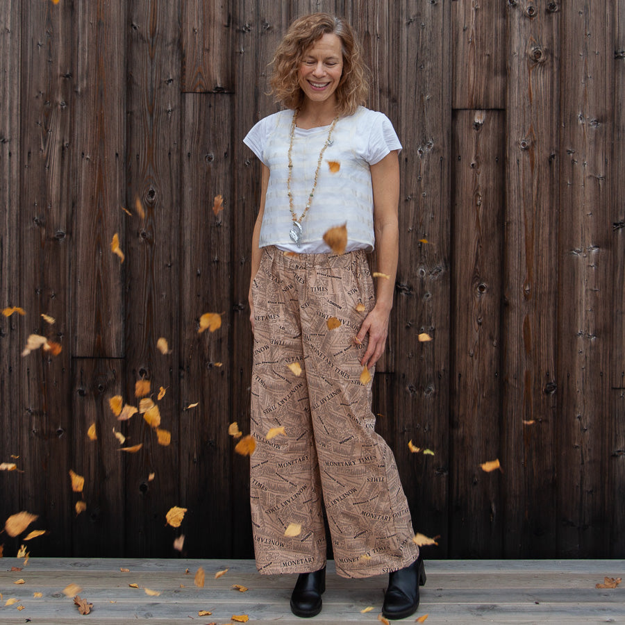 Trousers with a newspaper print