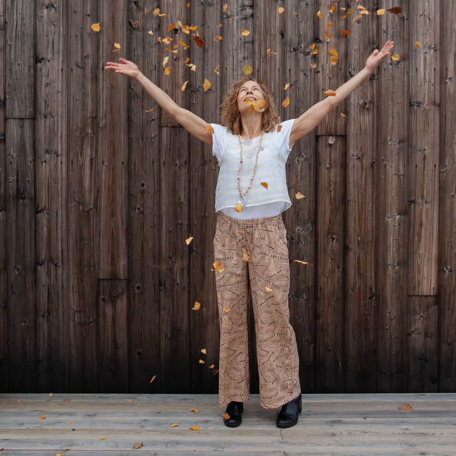 Trousers with a newspaper print