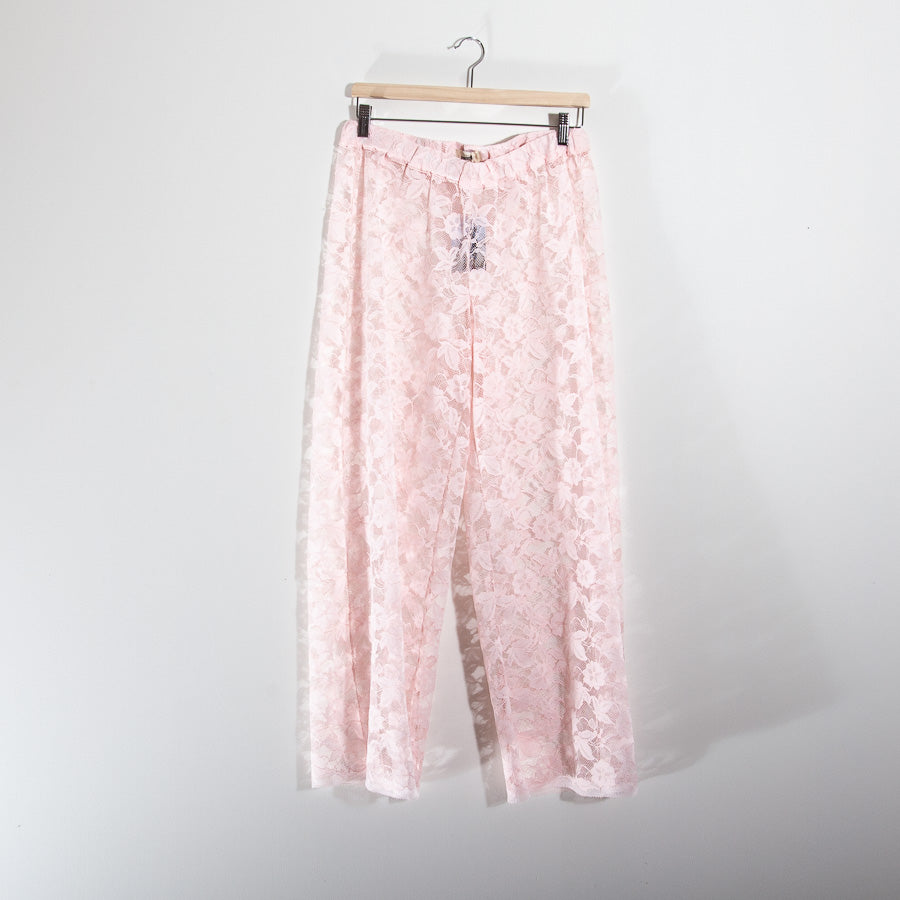 Pink trousers made from recycled lace