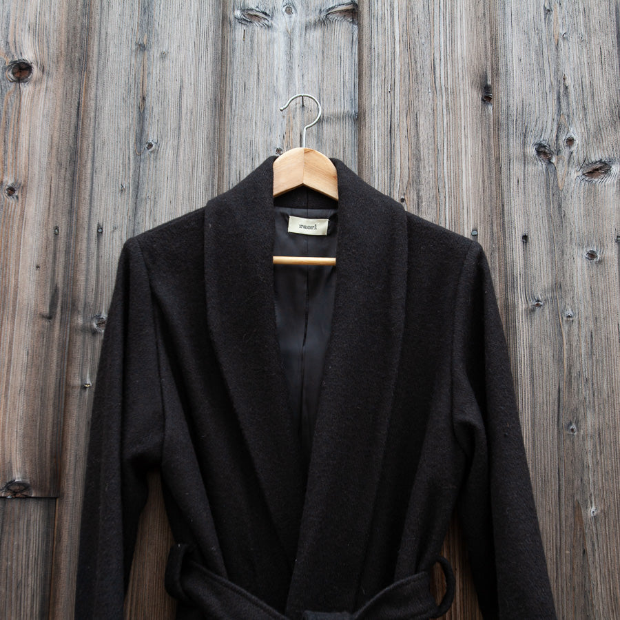 Black coat in a coat roll
